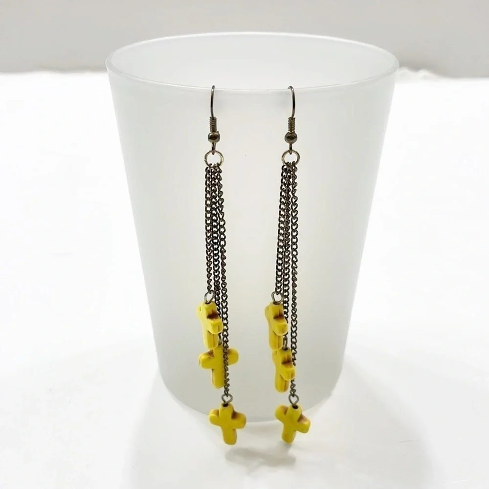 Yellow hanging cross earrings